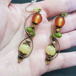 Gold tone green and orange bead earrings